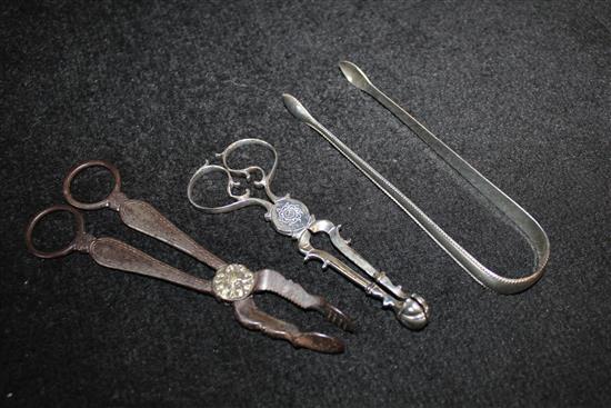 Silver sugar tongs and 2 nips